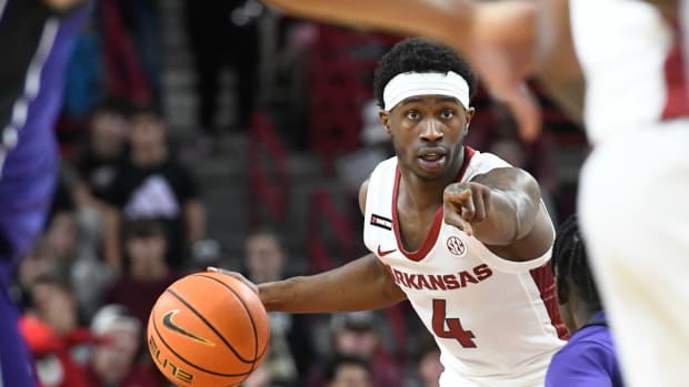 Arkansas guar Davonte Davis directs traffic in the Razorbacks' win over Abilene Christian.